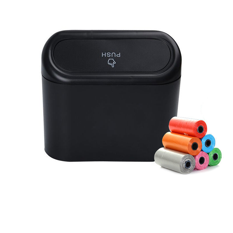 Black trash bin with push lid and colorful garbage bags on a white background